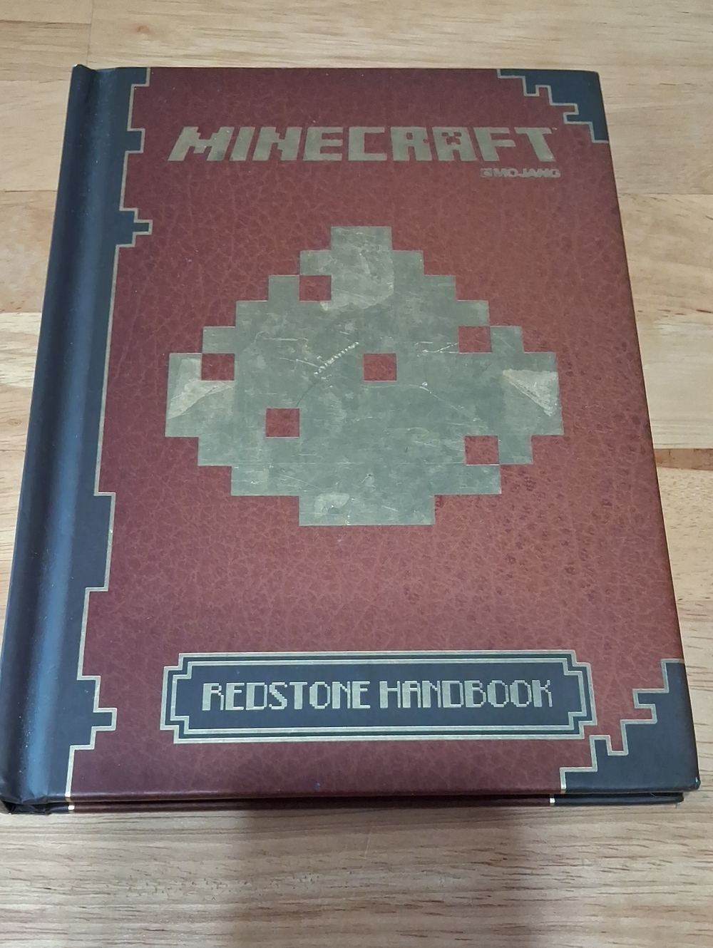 Minecraft Official Redstone Handbook - Brown and Gold Hardcover by Mojang